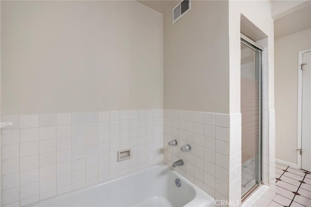 full bath featuring a shower stall, a bath, and visible vents