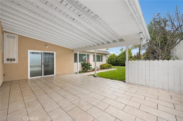 view of patio featuring fence