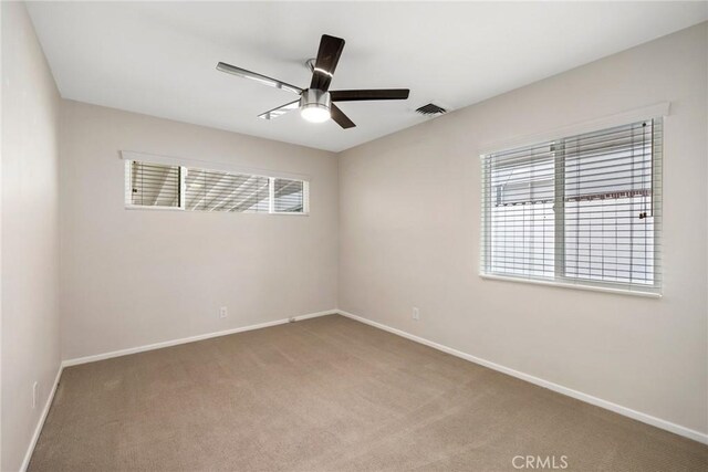 3822 S Cloverdale Ave, Los Angeles, CA 90008 - carpeted empty room with a ceiling fan and baseboards