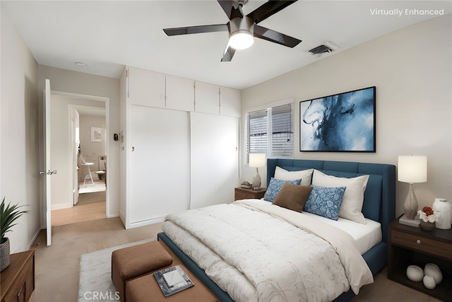 bedroom with visible vents, a closet, light carpet, baseboards, and a ceiling fan