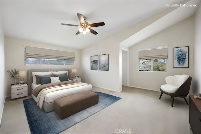 bedroom featuring a ceiling fan, baseboards, vaulted ceiling, and light carpet