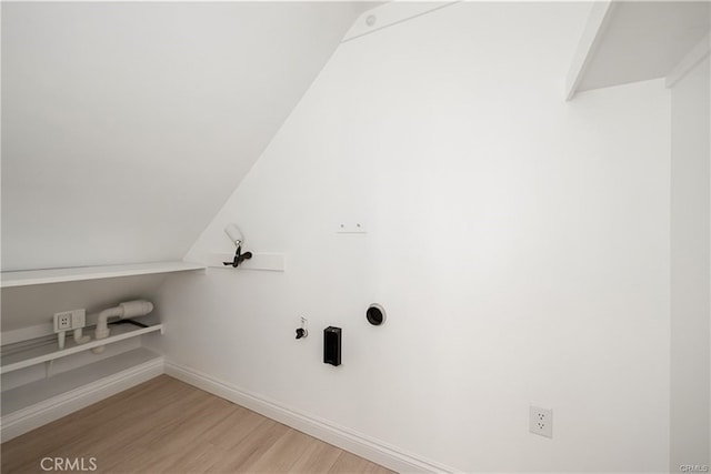3822 S Cloverdale Ave, Los Angeles, CA 90008 - washroom with light wood-style flooring and baseboards