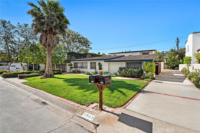 ranch-style house with a front yard