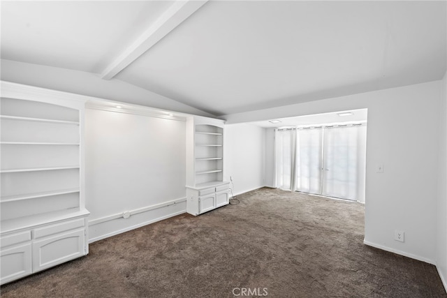 interior space with baseboards and lofted ceiling with beams