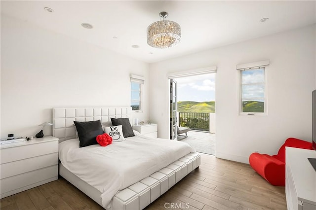 21 Alexa Ln, Ladera Ranch, CA 92694 - bedroom featuring access to outside and wood finished floors