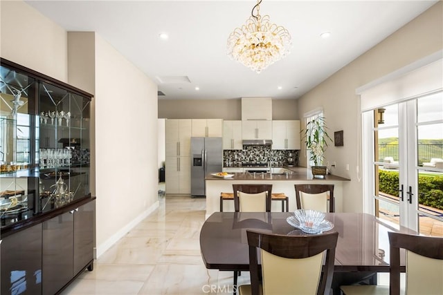 21 Alexa Ln, Ladera Ranch, CA 92694 - dining room featuring light marble finish floors, a chandelier, recessed lighting, and french doors