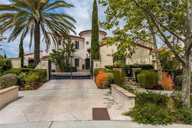 21 Alexa Ln, Ladera Ranch, CA 92694 - view of front of house featuring a gate and stucco siding