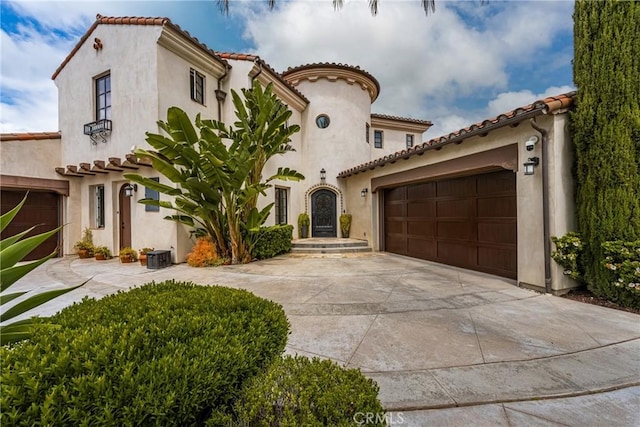 21 Alexa Ln, Ladera Ranch, CA 92694 - mediterranean / spanish house with an attached garage, stucco siding, and concrete driveway