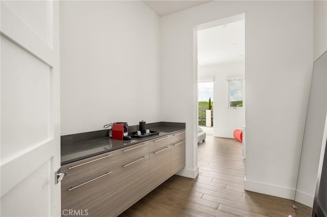 21 Alexa Ln, Ladera Ranch, CA 92694 - bar featuring wood finished floors and baseboards