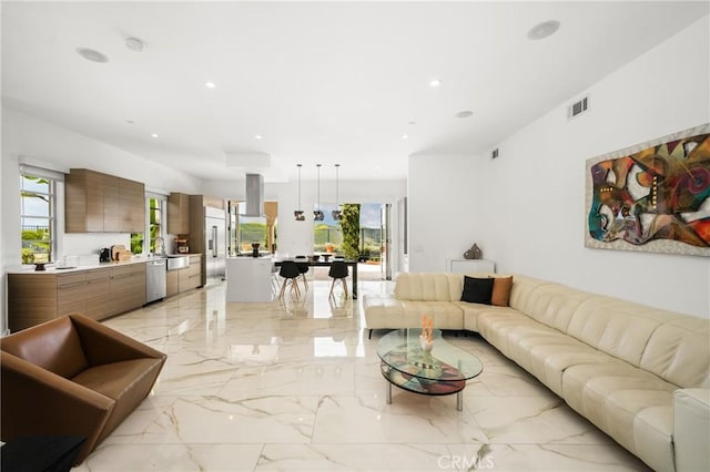 21 Alexa Ln, Ladera Ranch, CA 92694 - living area featuring light marble finish floors and recessed lighting