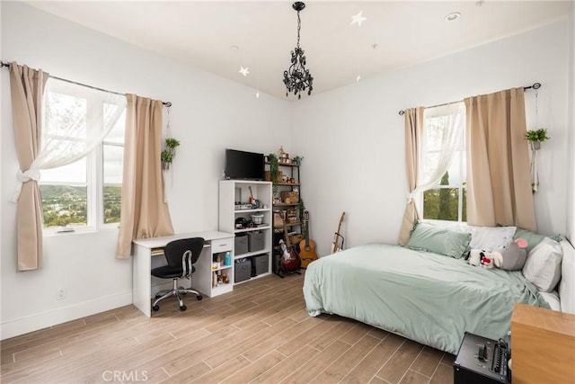 21 Alexa Ln, Ladera Ranch, CA 92694 - bedroom with multiple windows, light wood-style floors, and a desk
