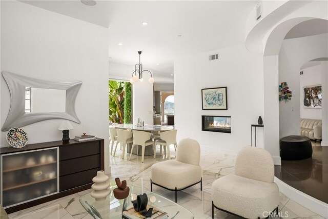 21 Alexa Ln, Ladera Ranch, CA 92694 - living area with light marble finish flooring, arched walkways, and recessed lighting