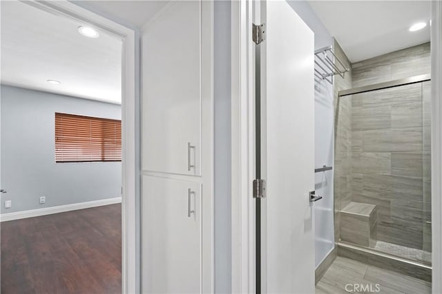 5414 Newcastle Ave Unit 66, Encino, CA 91316 - bathroom featuring a shower stall, baseboards, recessed lighting, and wood finished floors