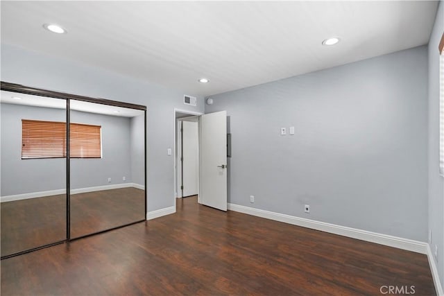 5414 Newcastle Ave Unit 66, Encino, CA 91316 - unfurnished bedroom featuring wood finished floors, a closet, baseboards, and recessed lighting