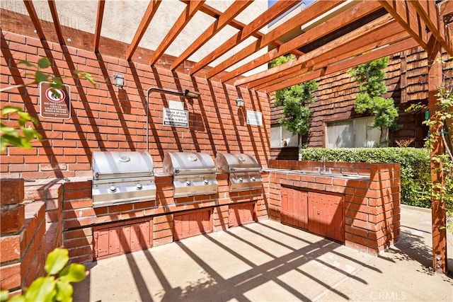 5414 Newcastle Ave Unit 66, Encino, CA 91316 - view of patio featuring a pergola and a sink