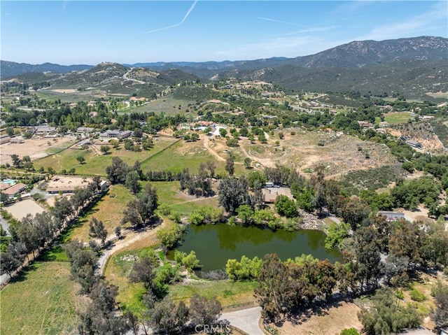 bird's eye view with a water and mountain view