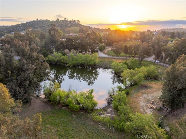 aerial view at dusk with a water view