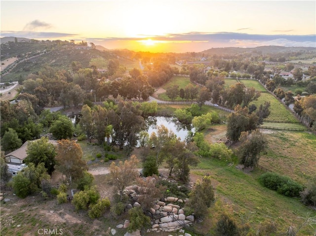 birds eye view of property with a mountain view