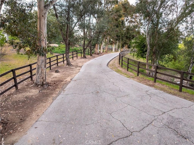 view of property's community with fence