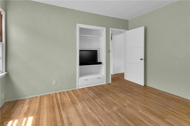 unfurnished bedroom featuring light wood finished floors