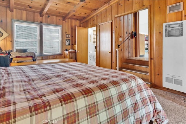 carpeted bedroom featuring wooden walls, wood ceiling, lofted ceiling with beams, and a heating unit