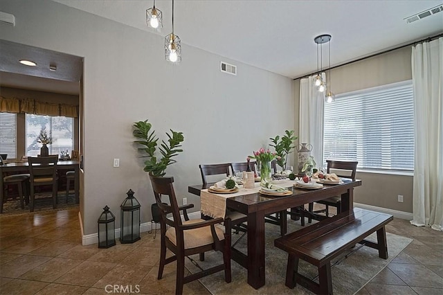 31961 Honeysuckle Cir, Winchester, CA 92596 - dining space featuring dark tile patterned flooring and baseboards