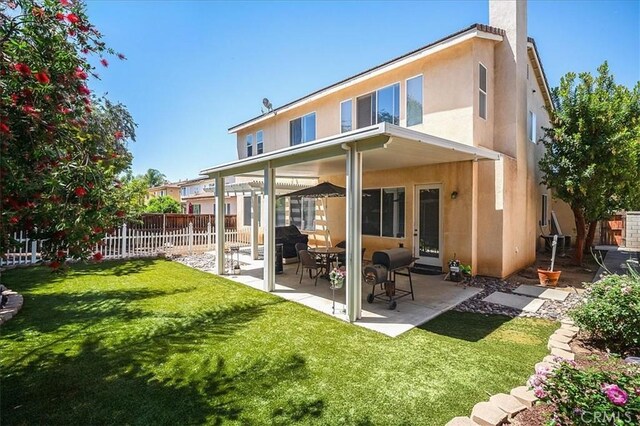 31961 Honeysuckle Cir, Winchester, CA 92596 - back of property featuring a patio area, stucco siding, and a chimney