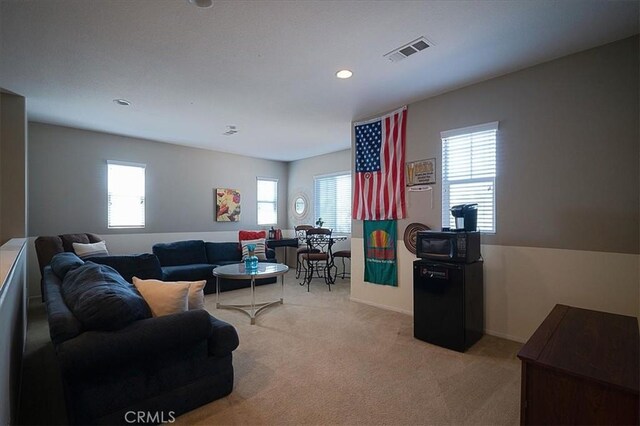 31961 Honeysuckle Cir, Winchester, CA 92596 - living area with healthy amount of natural light, carpet, recessed lighting, and baseboards
