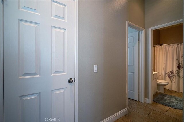 31961 Honeysuckle Cir, Winchester, CA 92596 - corridor featuring tile patterned flooring and baseboards