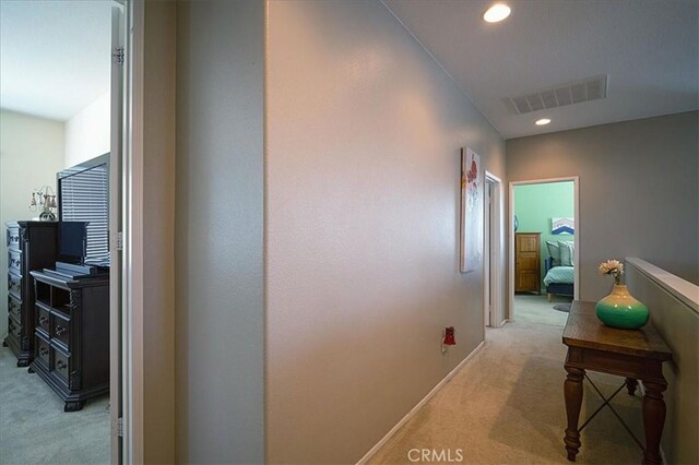 31961 Honeysuckle Cir, Winchester, CA 92596 - hallway featuring light carpet, recessed lighting, and baseboards