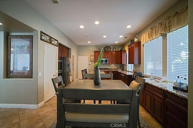31961 Honeysuckle Cir, Winchester, CA 92596 - dining area with light tile patterned floors, recessed lighting, and baseboards