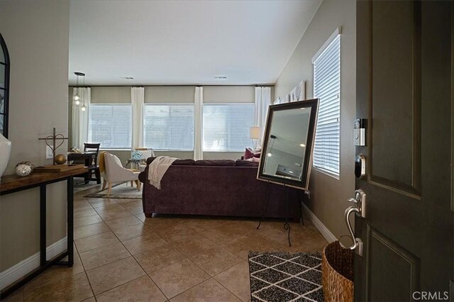 31961 Honeysuckle Cir, Winchester, CA 92596 - tiled living room with baseboards