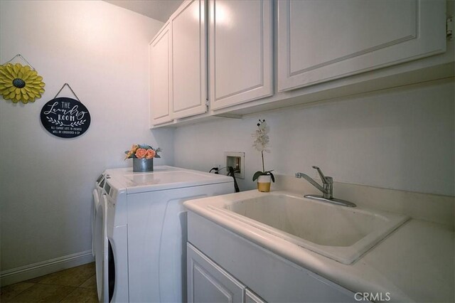 31961 Honeysuckle Cir, Winchester, CA 92596 - clothes washing area featuring washing machine and dryer, cabinet space, baseboards, and dark tile patterned flooring
