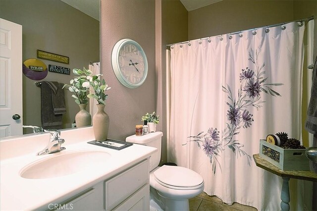 31961 Honeysuckle Cir, Winchester, CA 92596 - bathroom featuring toilet, tile patterned floors, vanity, and a shower with shower curtain