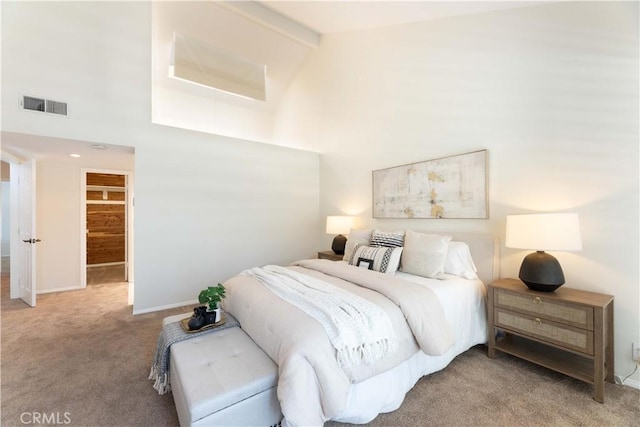 carpeted bedroom featuring high vaulted ceiling, baseboards, beam ceiling, and visible vents