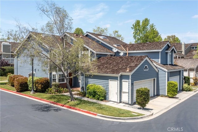 view of front of home featuring a garage and concrete driveway