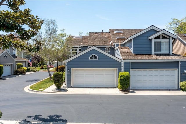 multi unit property featuring a garage
