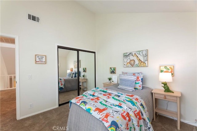carpeted bedroom with high vaulted ceiling, visible vents, baseboards, and a closet