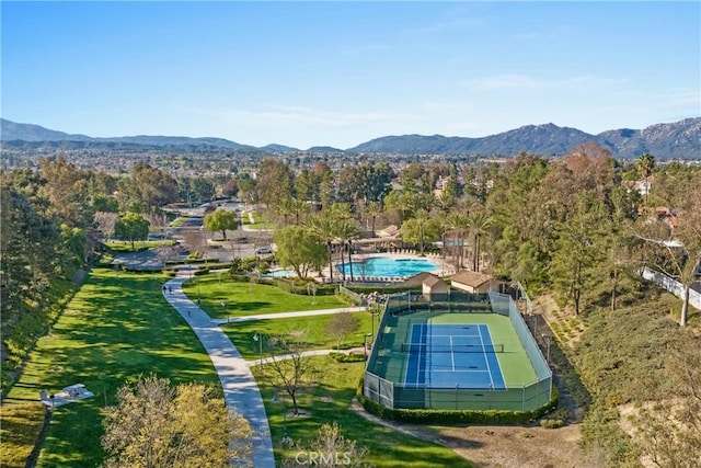 birds eye view of property with a mountain view