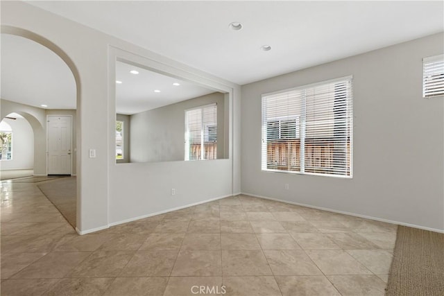 31937 Calle Galarza, Temecula, CA 92592 - spare room with light tile patterned floors, arched walkways, recessed lighting, and baseboards