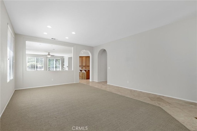 31937 Calle Galarza, Temecula, CA 92592 - unfurnished room featuring arched walkways, recessed lighting, a ceiling fan, light colored carpet, and light tile patterned flooring