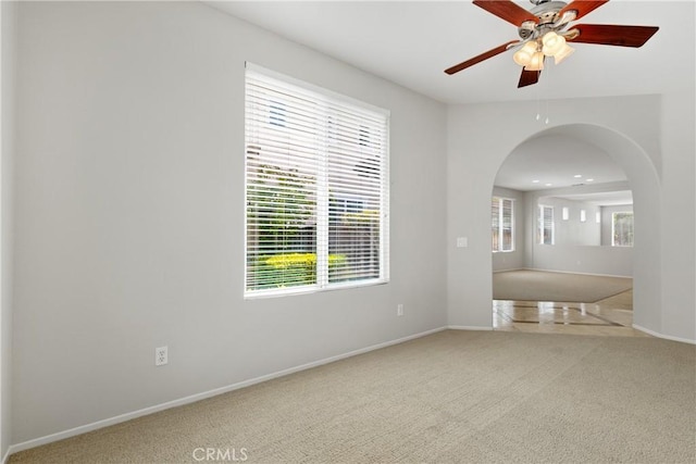31937 Calle Galarza, Temecula, CA 92592 - spare room with arched walkways, carpet flooring, ceiling fan, and plenty of natural light