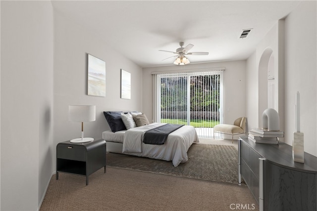 31937 Calle Galarza, Temecula, CA 92592 - carpeted bedroom featuring arched walkways, access to exterior, and a ceiling fan