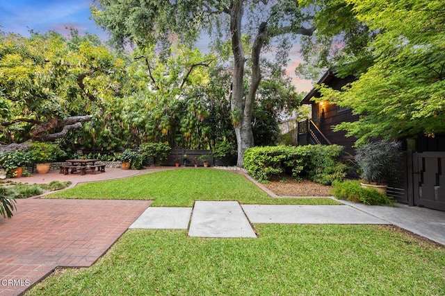 view of yard with fence and a patio area