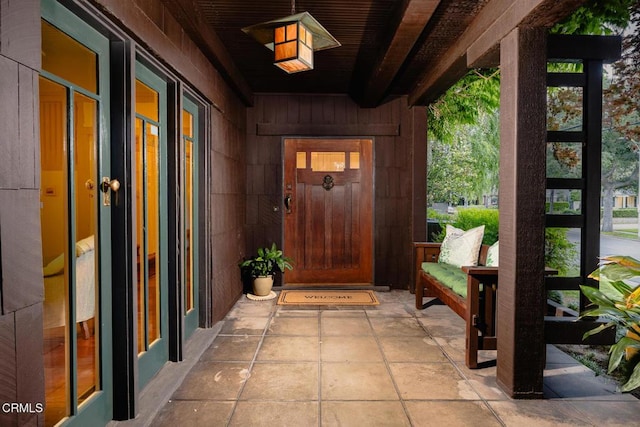 doorway to property with covered porch