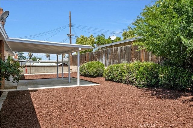 view of yard with a fenced backyard and a patio