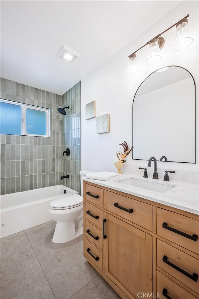 full bath featuring vanity, tile patterned flooring, toilet, and tub / shower combination