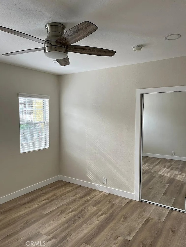 1861 S Redondo Blvd, Los Angeles, CA 90019 - empty room featuring baseboards, ceiling fan, and wood finished floors