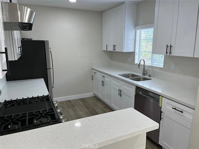 1861 S Redondo Blvd, Los Angeles, CA 90019 - kitchen with dark wood-style flooring, appliances with stainless steel finishes, a sink, white cabinetry, and range hood