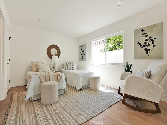 interior space featuring light wood-style floors, baseboards, and recessed lighting